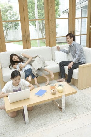 girl using laptop at coffee table